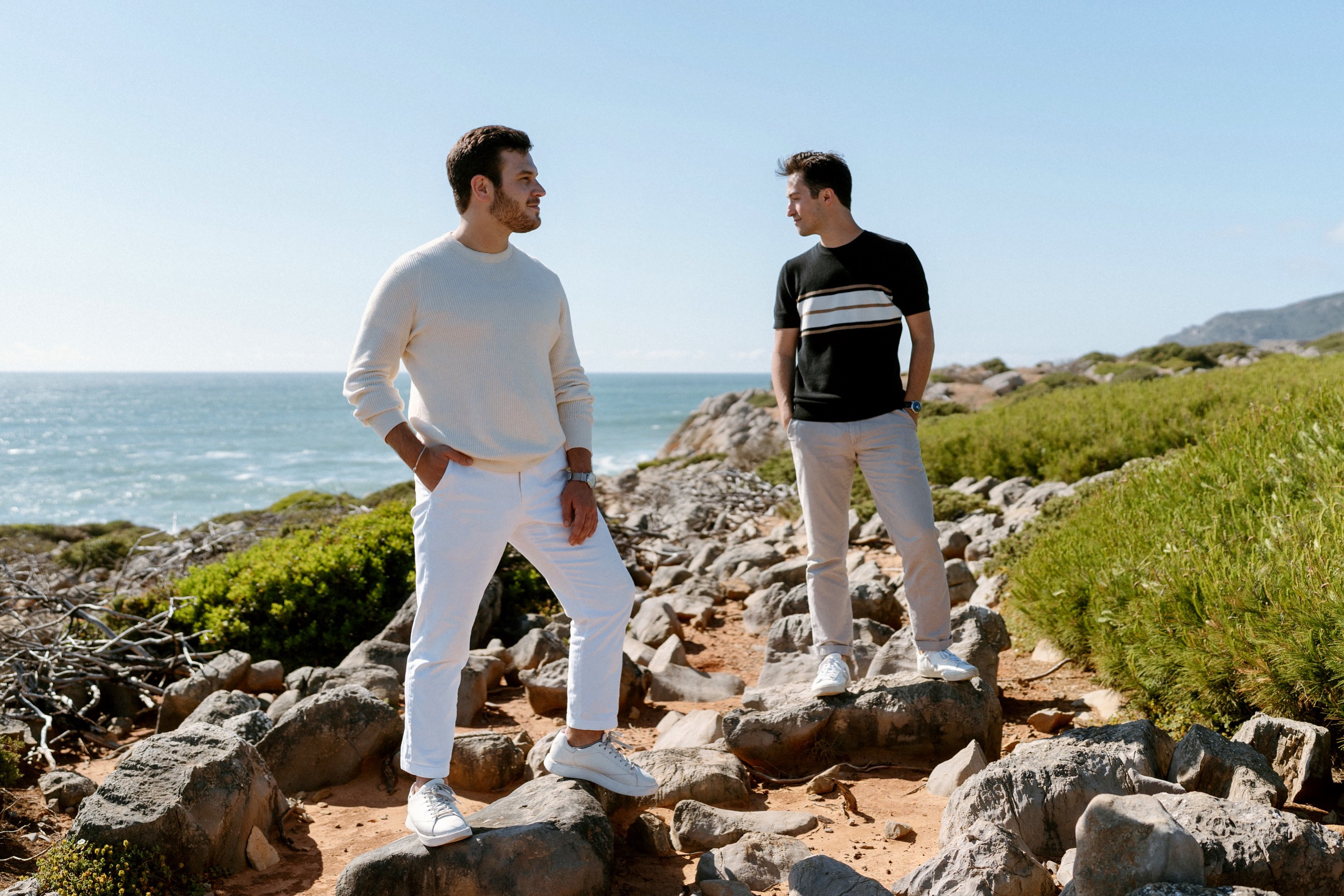 Phil and Zack together on the coast during their engagement photos in Portugal