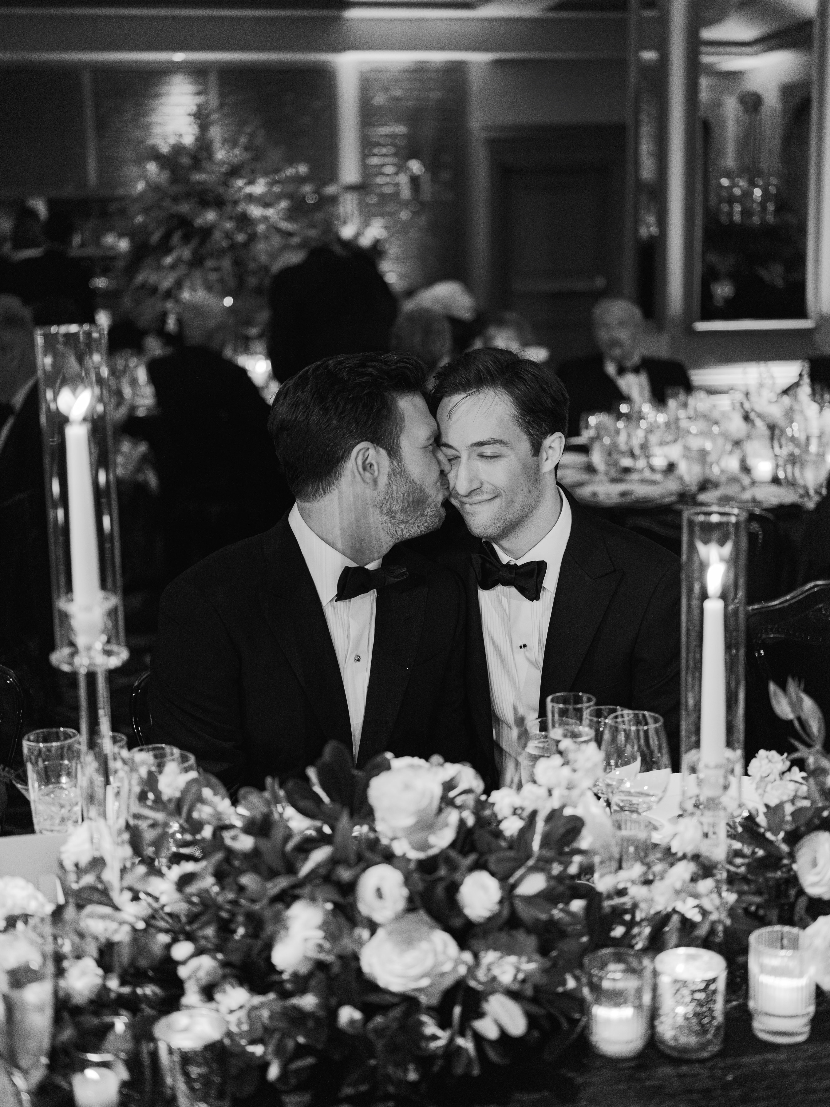 Phil and Zack sharing a quiet moment at their wedding reception
