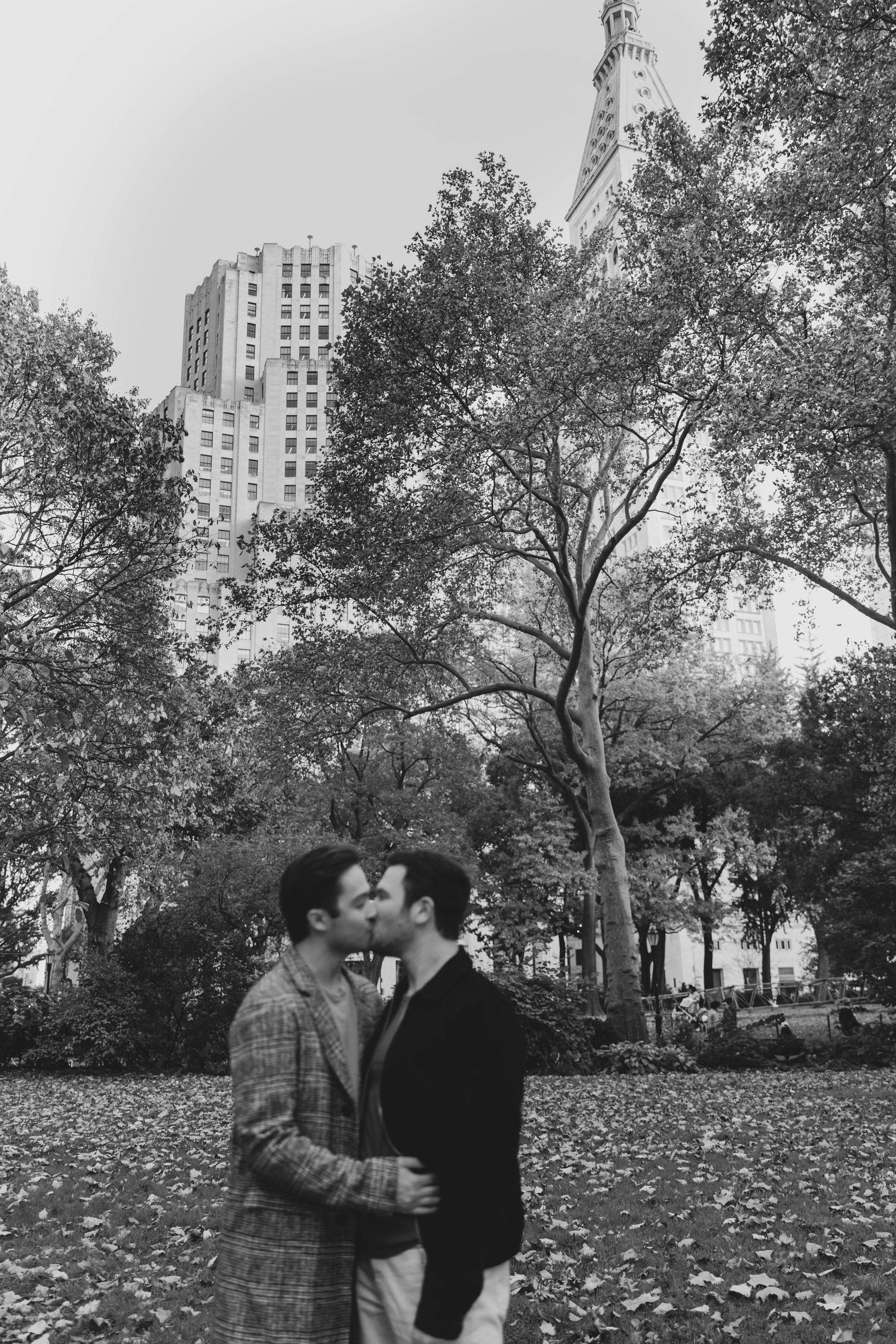 Phil and Zack kissing in a New York City park